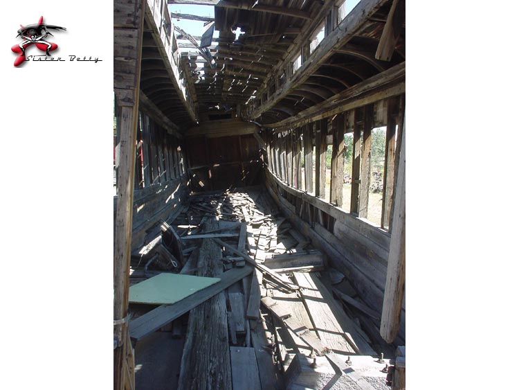 Narrow Guage coach in severe disrepair -interior view
